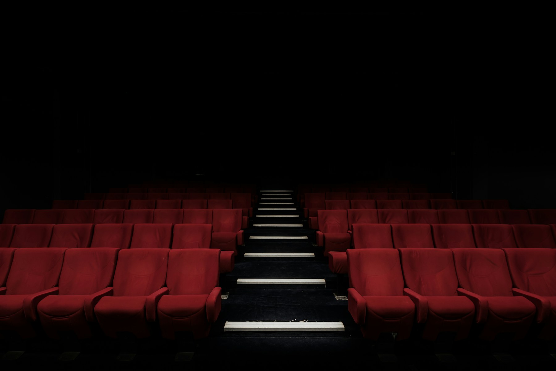 Empty Cinema 1 auditorium with red velvet seats