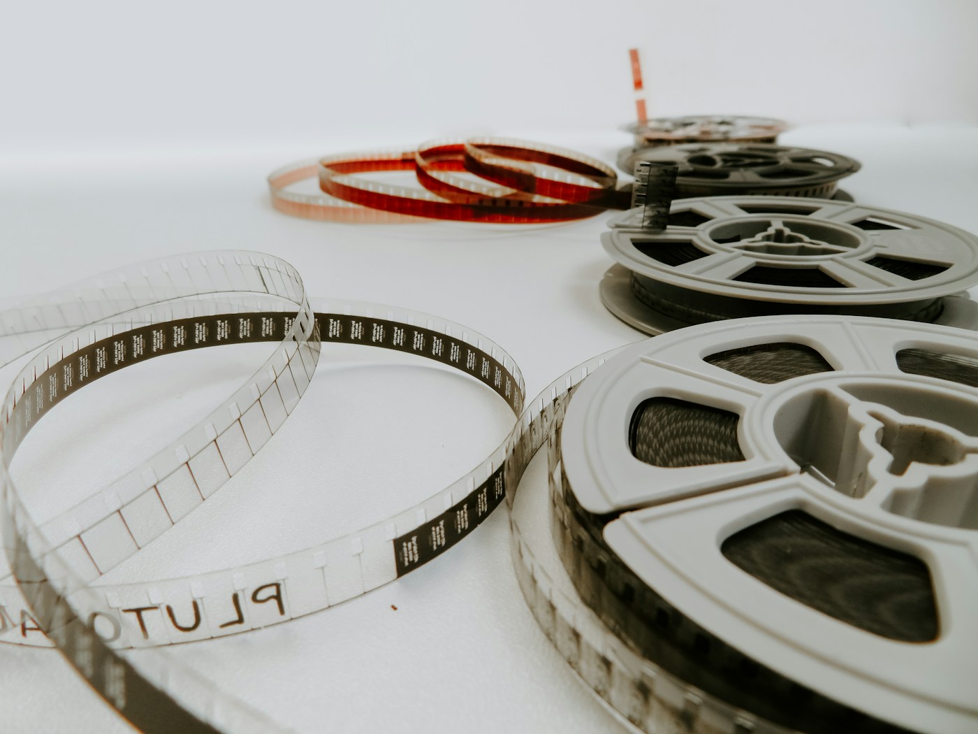 35mm film reels arranged on a white surface
