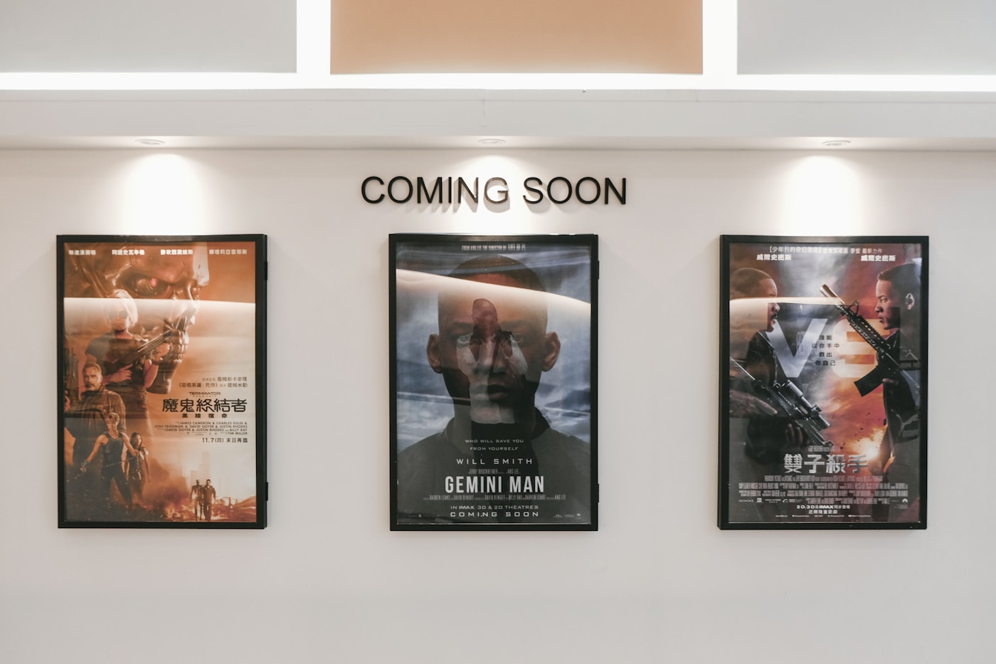 Coming-soon poster wall in the lobby